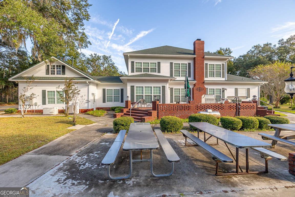 300 Elliott Road Waynesville, GA 31566 - Photo 12 of 89 a view of a house with swimming pool and sitting area
