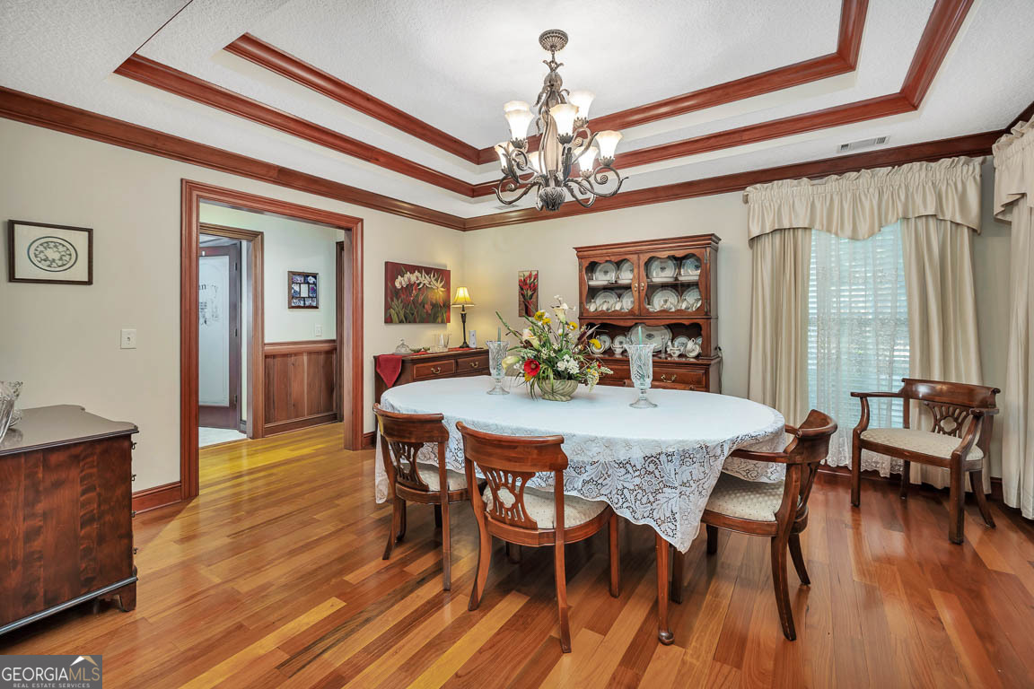 300 Elliott Road Waynesville, GA 31566 - Photo 30 of 89 a view of a dining room with furniture window and wooden floor