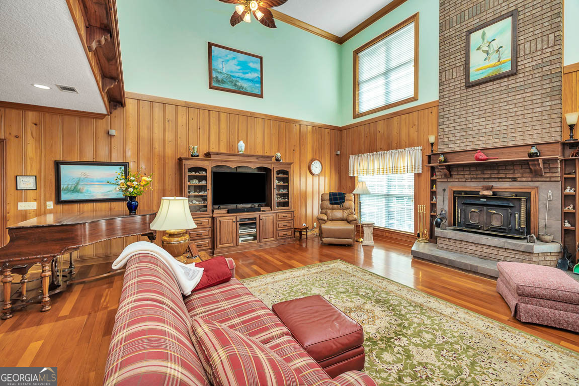 300 Elliott Road Waynesville, GA 31566 - Photo 35 of 89 a living room with furniture a flat screen tv and a fireplace