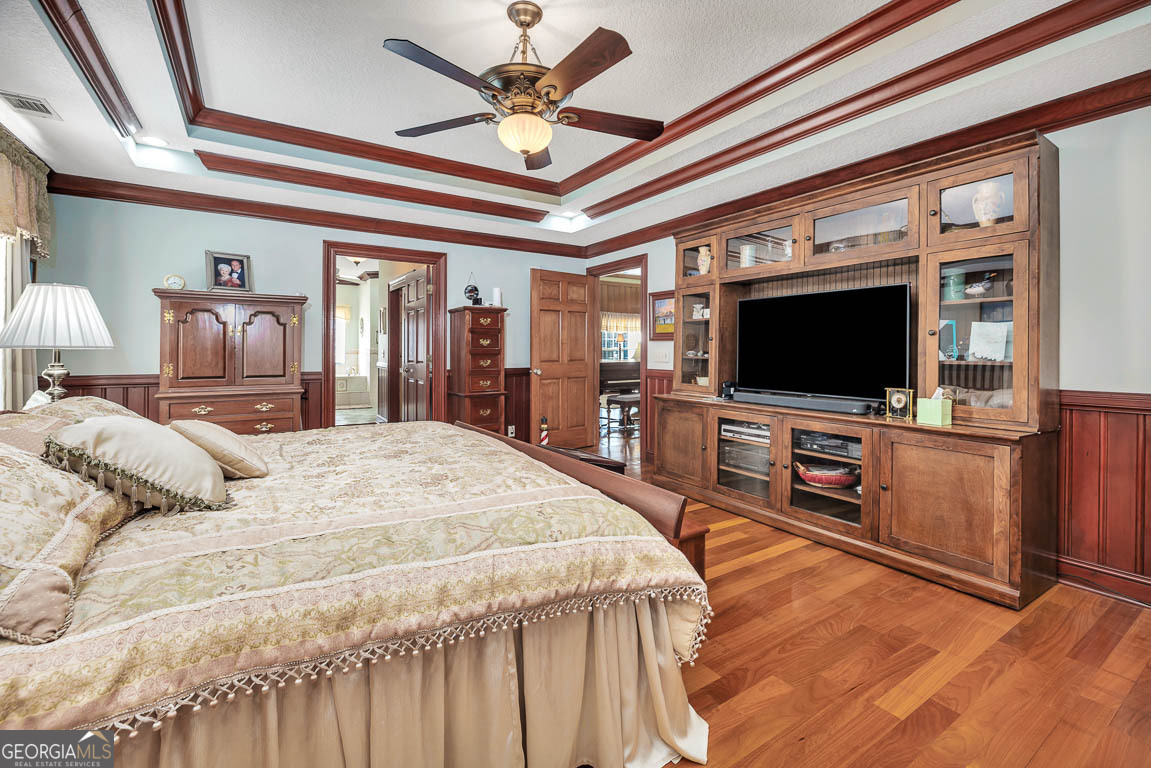 300 Elliott Road Waynesville, GA 31566 - Photo 39 of 89 a bedroom with a bed and a flat screen tv