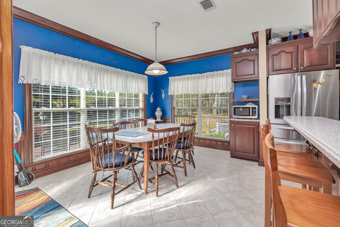 300 Elliott Road Waynesville, GA 31566 - Photo 44 of 89 a view of a dining room with furniture window and outside view