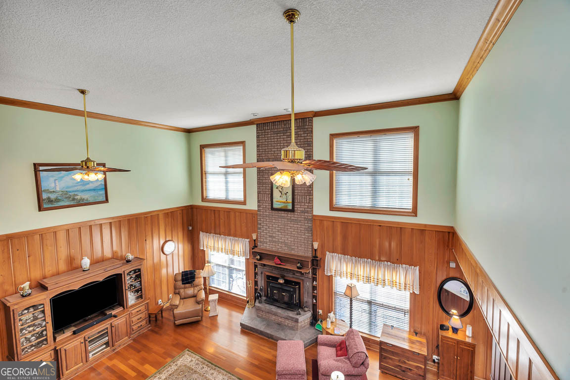 300 Elliott Road Waynesville, GA 31566 - Photo 56 of 89 a living room with furniture a fireplace and a flat screen tv