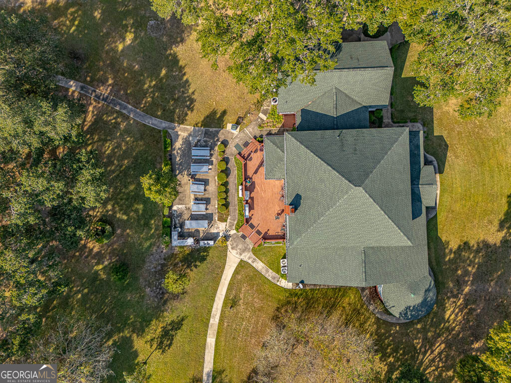300 Elliott Road Waynesville, GA 31566 - Photo 77 of 89 an aerial view of a house with a yard and trees