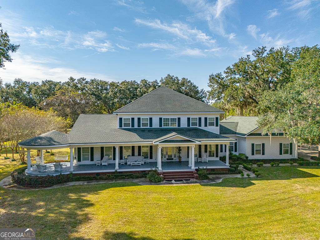 300 Elliott Road Waynesville, GA 31566 - Photo 79 of 89 a front view of a house with swimming pool