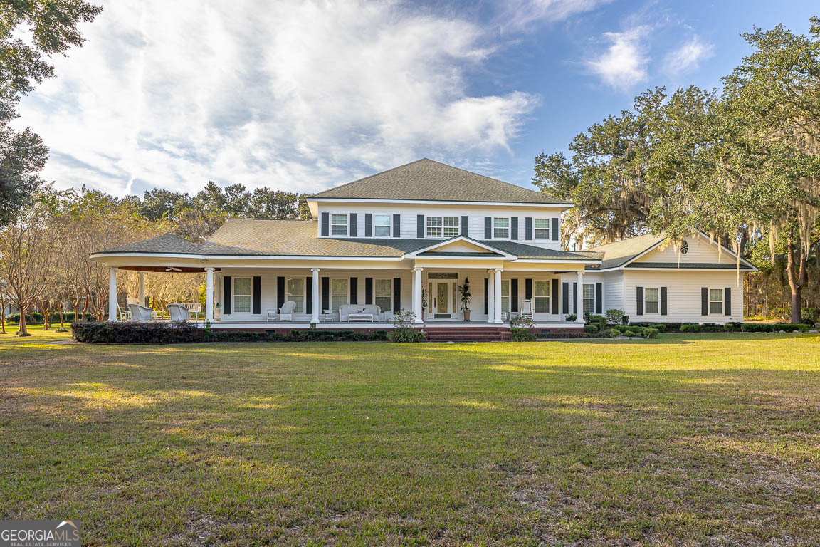 300 Elliott Road Waynesville, GA 31566 - Photo 87 of 89 a front view of a house with swimming pool