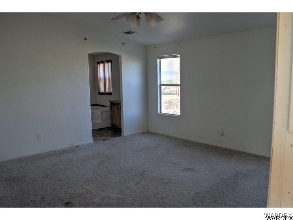 3969 Elfrida Road Golden Valley, AZ 86413 - Photo 14 of 29 a view of an empty room with a window
