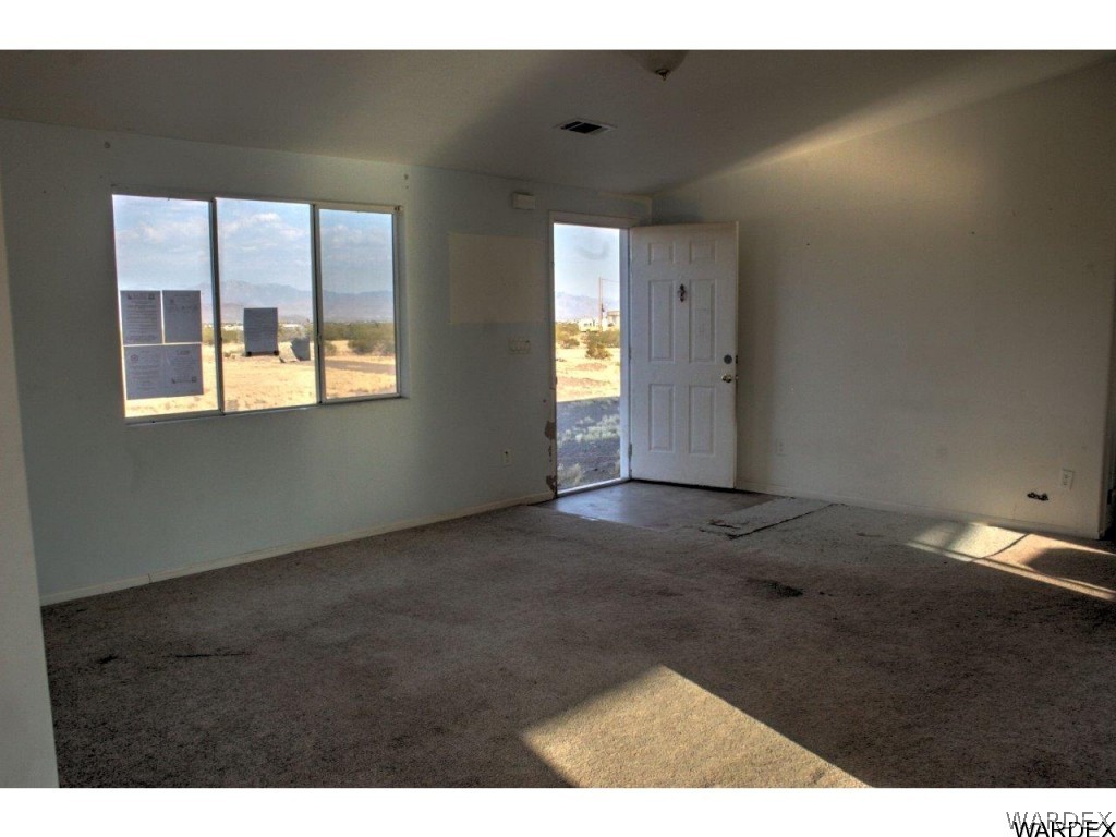 3969 Elfrida Road Golden Valley, AZ 86413 - Photo 3 of 29 a view of empty room with window