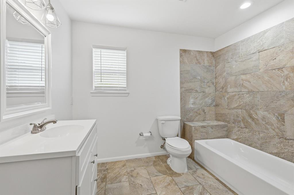 204 East Bailey Street Ponder, TX 76259 - Photo 12 of 33 Full bathroom with vanity and tub / shower combination