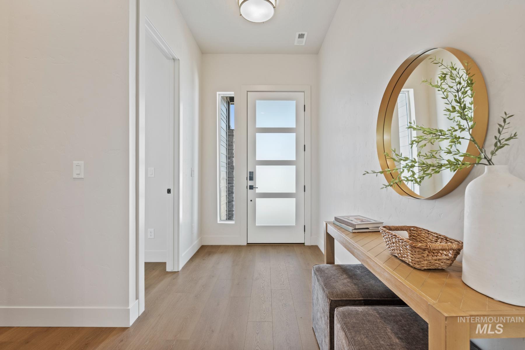 2866 North Stone Mill Avenue, Unit ROUGE Eagle, ID 83616 - Photo 2 of 18 Foyer featuring light wood-type flooring and baseboards