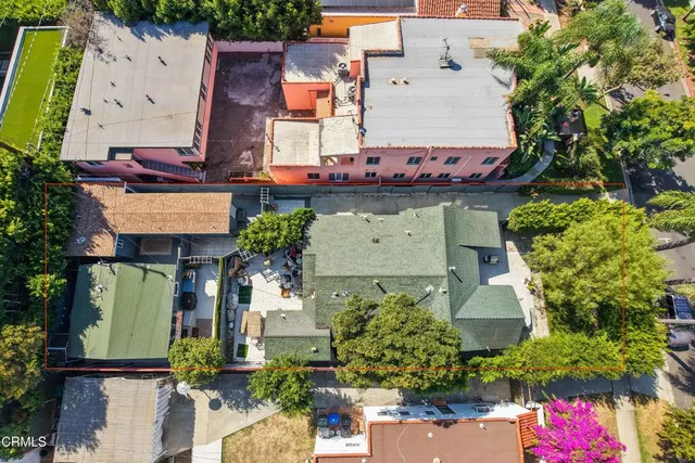 an aerial view of a house with a garden