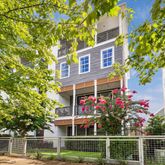 front view of a house with a tree