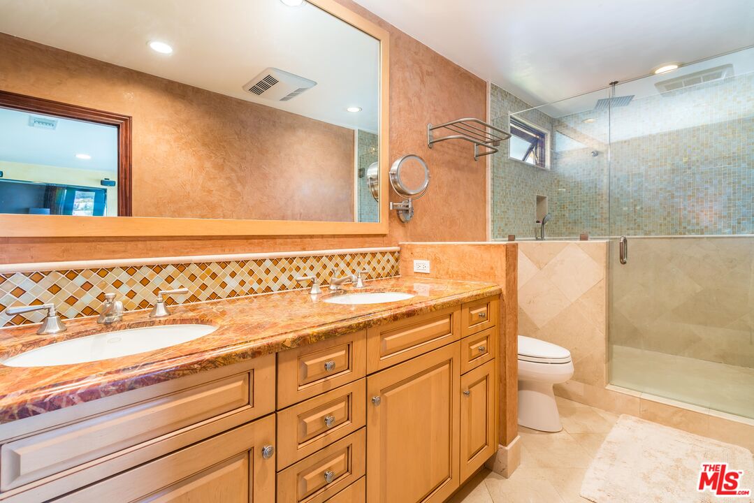 3643 Oceanhill Way Malibu, CA 90265 - Photo 19 of 28 a bathroom with a sink a toilet and a shower