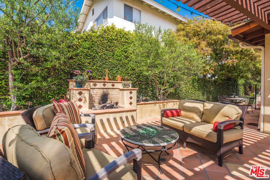 3643 Oceanhill Way Malibu, CA 90265 - Photo 26 of 28 a terrace with outdoor seating and trees