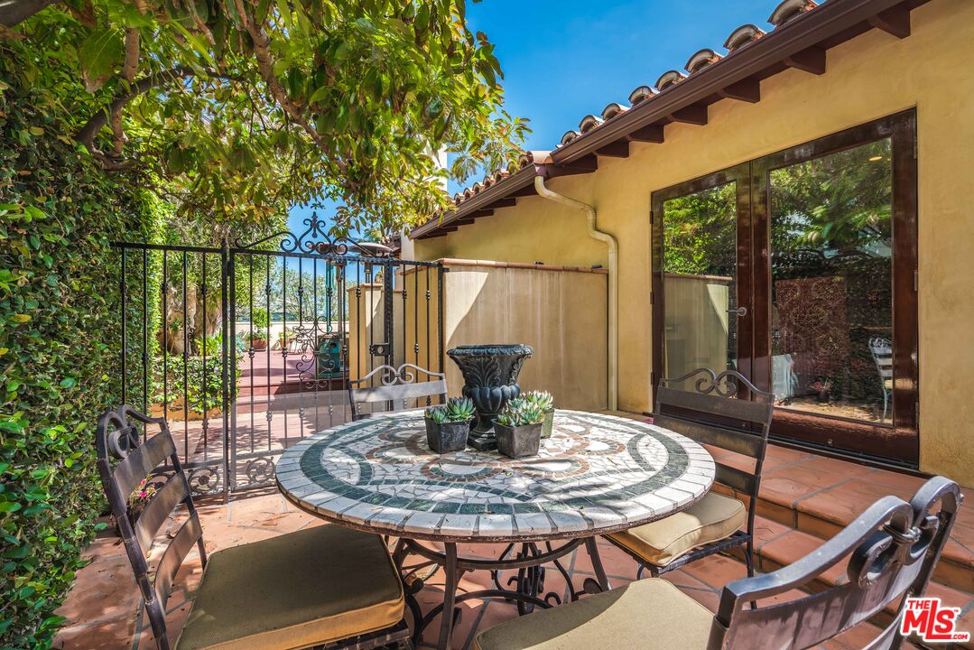 3643 Oceanhill Way Malibu, CA 90265 - Photo 28 of 28 a view of a patio with a table chairs and a table