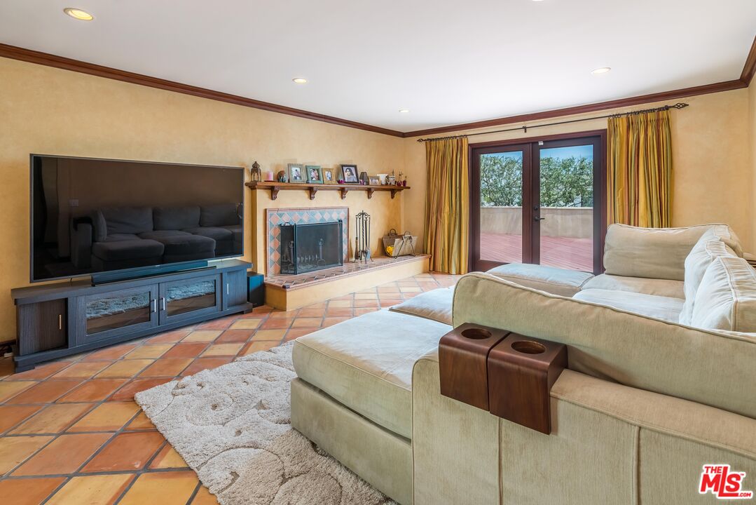 3643 Oceanhill Way Malibu, CA 90265 - Photo 7 of 28 a living room with furniture and a flat screen tv