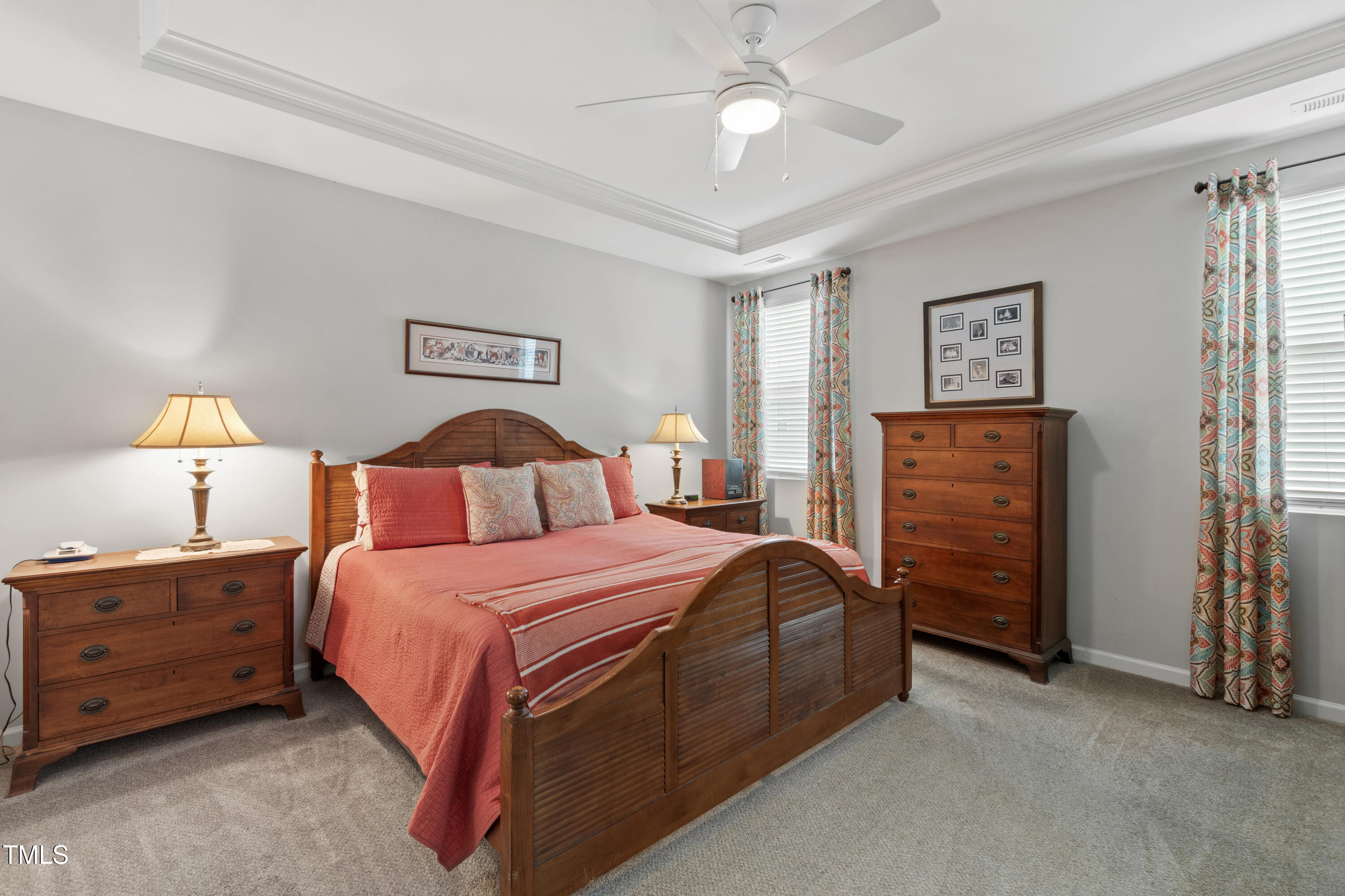 321 Everly Mist Way Wake Forest, NC 27587 - Photo 19 of 38 a bedroom with a bed and a chandelier