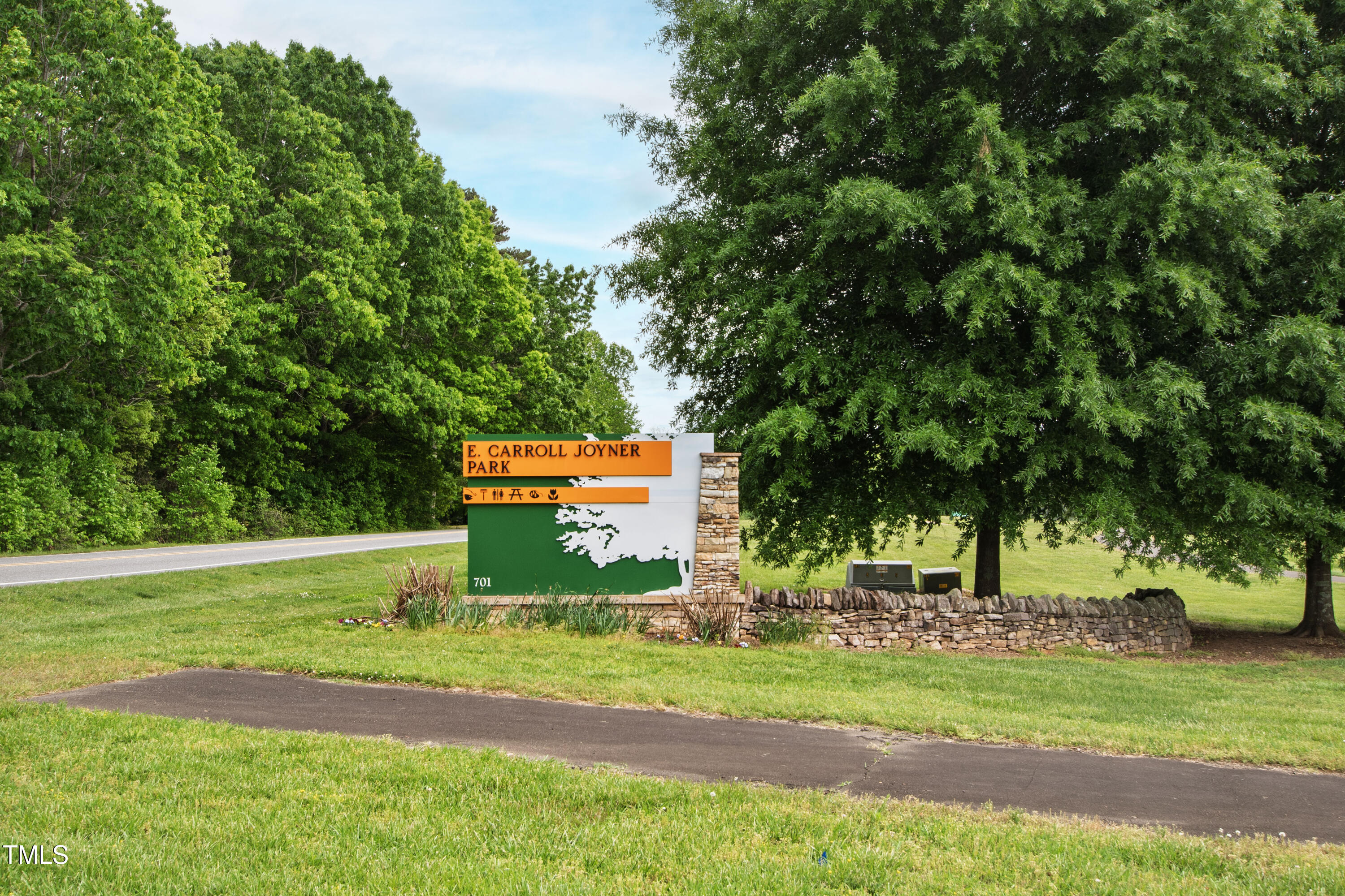 321 Everly Mist Way Wake Forest, NC 27587 - Photo 33 of 38 a green field with trees in the background