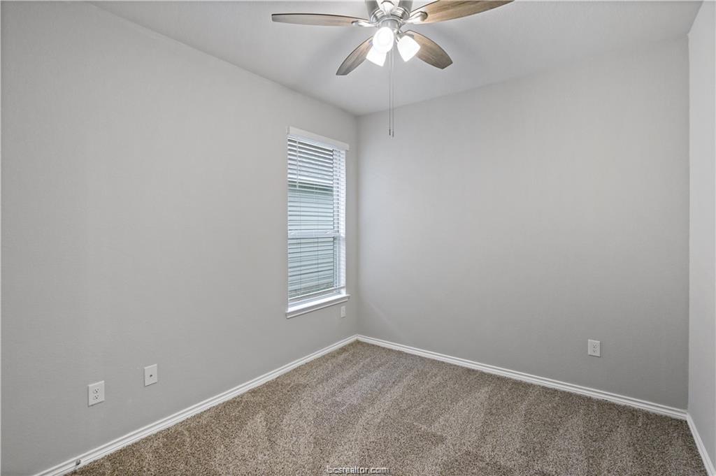 827 Mineral Wells Lane College Station, TX 77845 - Photo 16 of 23 an empty room with windows and fan