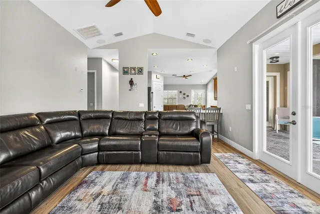 a bedroom with a bed and a ceiling fan