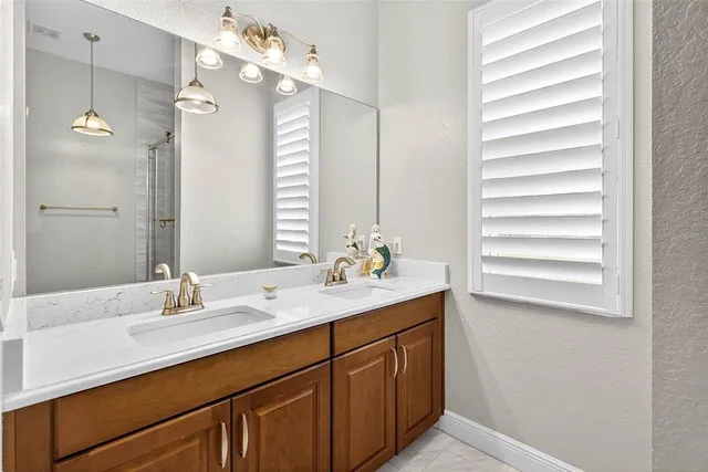 a view of a patio with a table chairs and a floor to ceiling window
