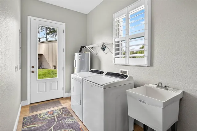 a kitchen with granite countertop a refrigerator and a sink