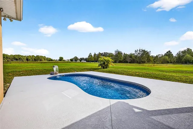 a view of a playground with basketball court
