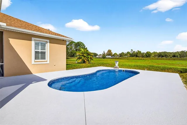 a view of a lake with a big yard