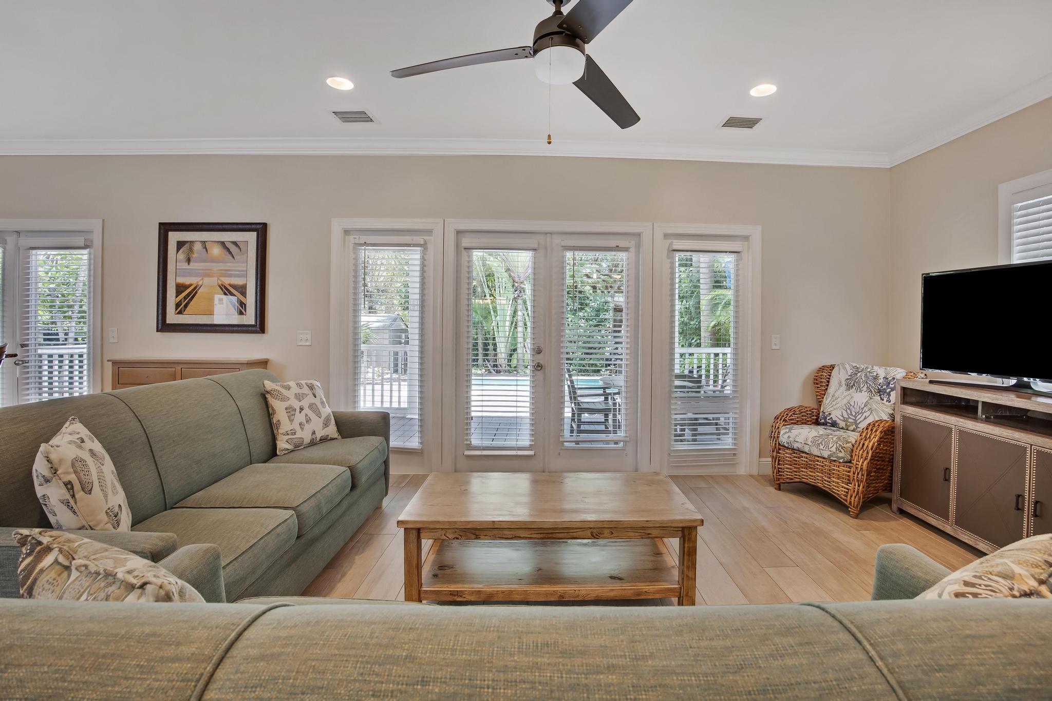 7204 Simran Lane Marathon, FL 33050 - Photo 12 of 47 a living room with furniture and a flat screen tv