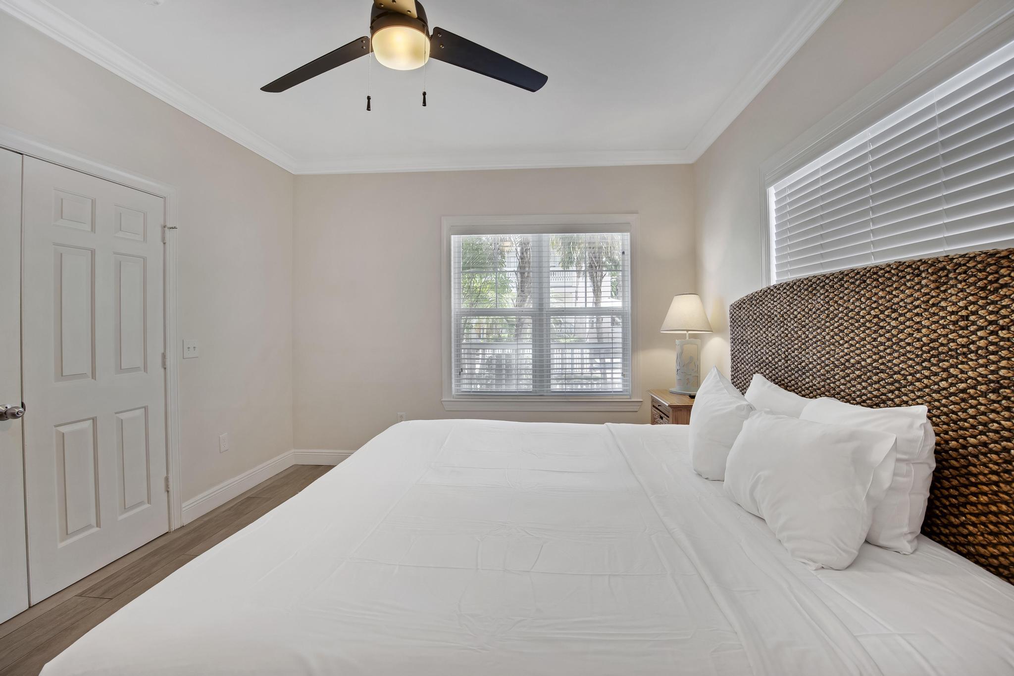 7204 Simran Lane Marathon, FL 33050 - Photo 15 of 47 a bedroom with a large bed and a window