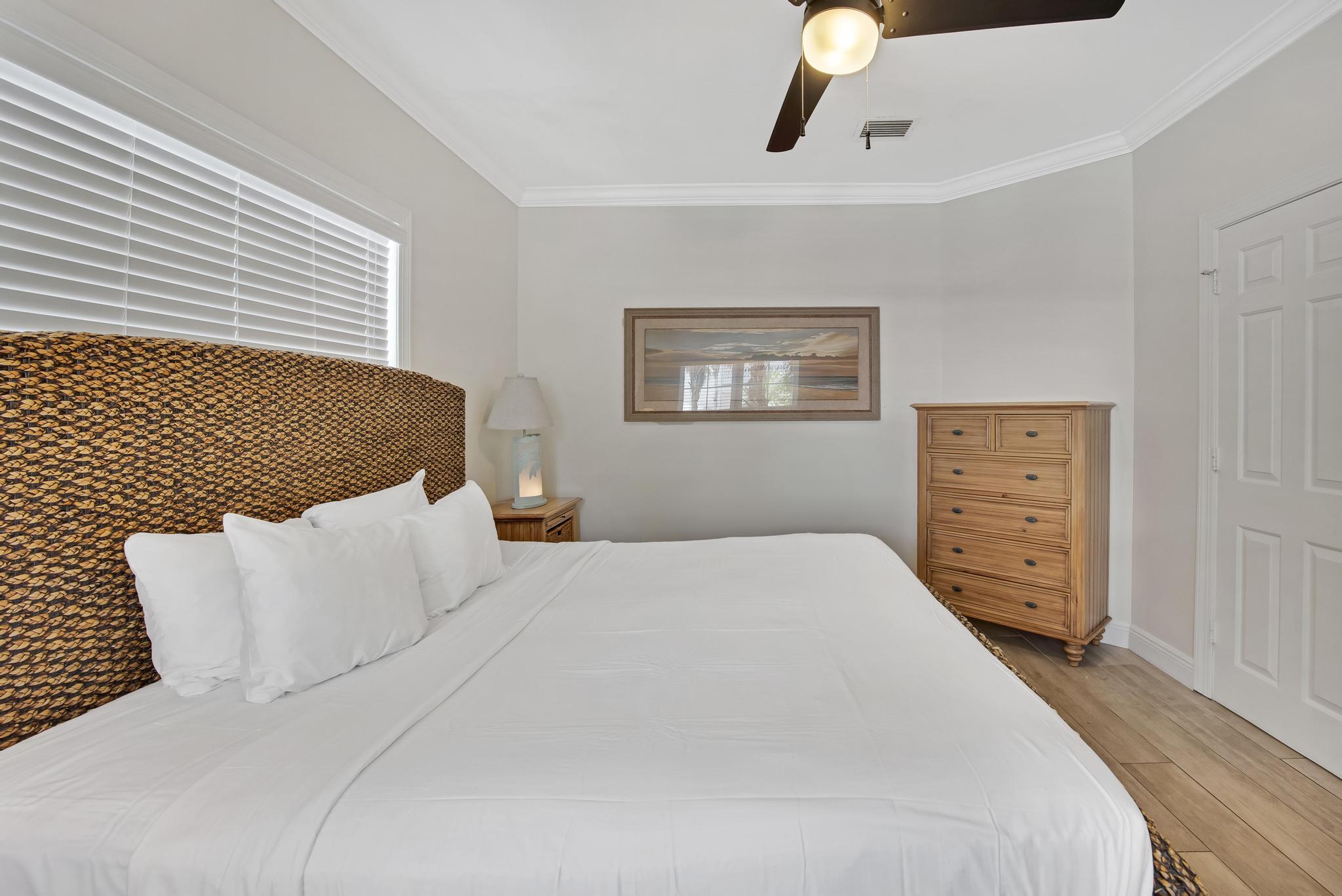 7204 Simran Lane Marathon, FL 33050 - Photo 17 of 47 a bedroom with bed and wooden floor