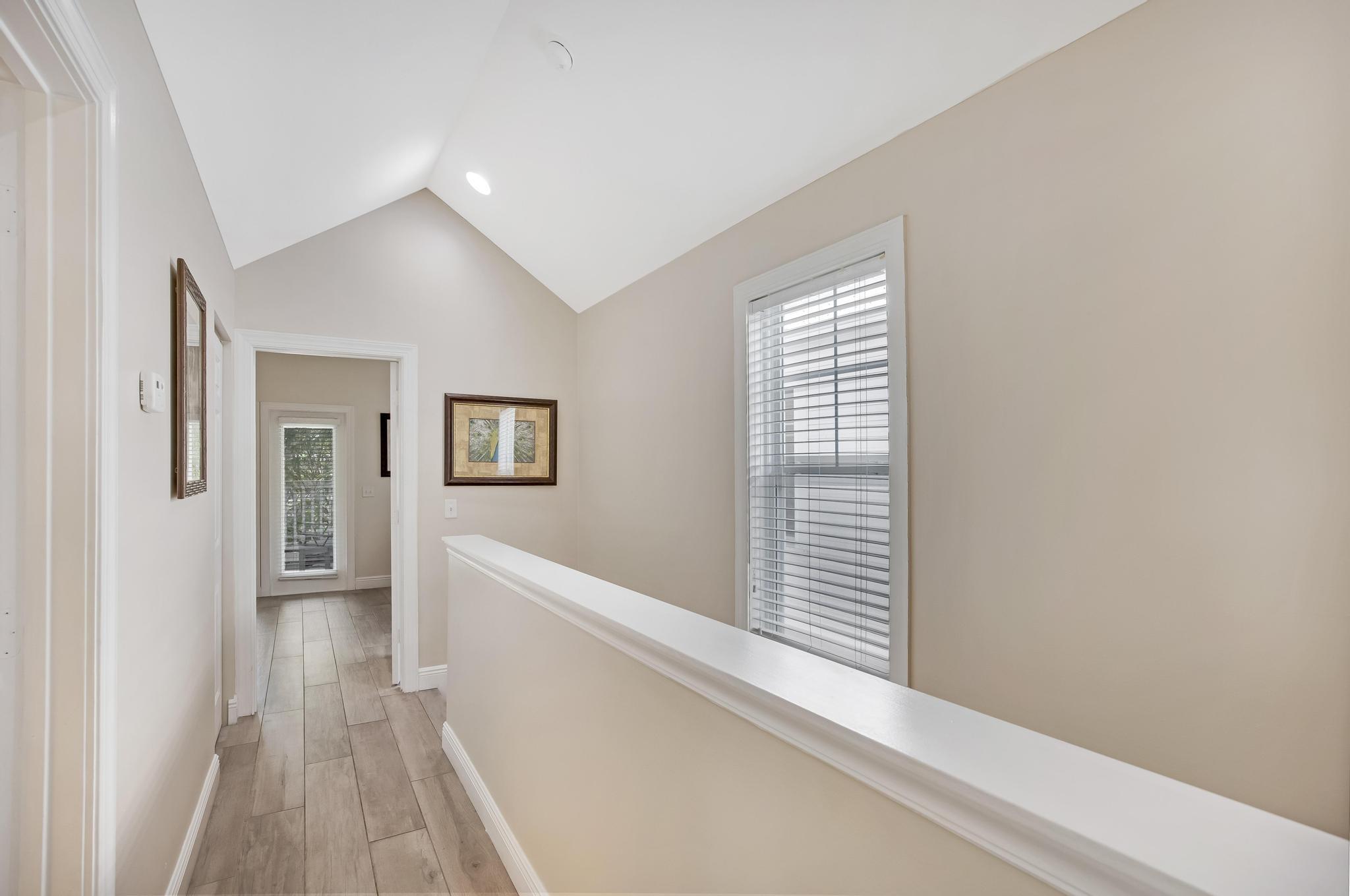 7204 Simran Lane Marathon, FL 33050 - Photo 18 of 47 a view of a hallway with closet and wooden floor