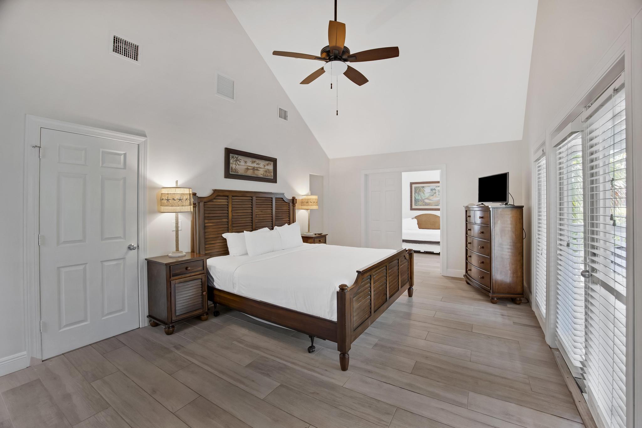 7204 Simran Lane Marathon, FL 33050 - Photo 21 of 47 a bed room with a bed and a ceiling fan