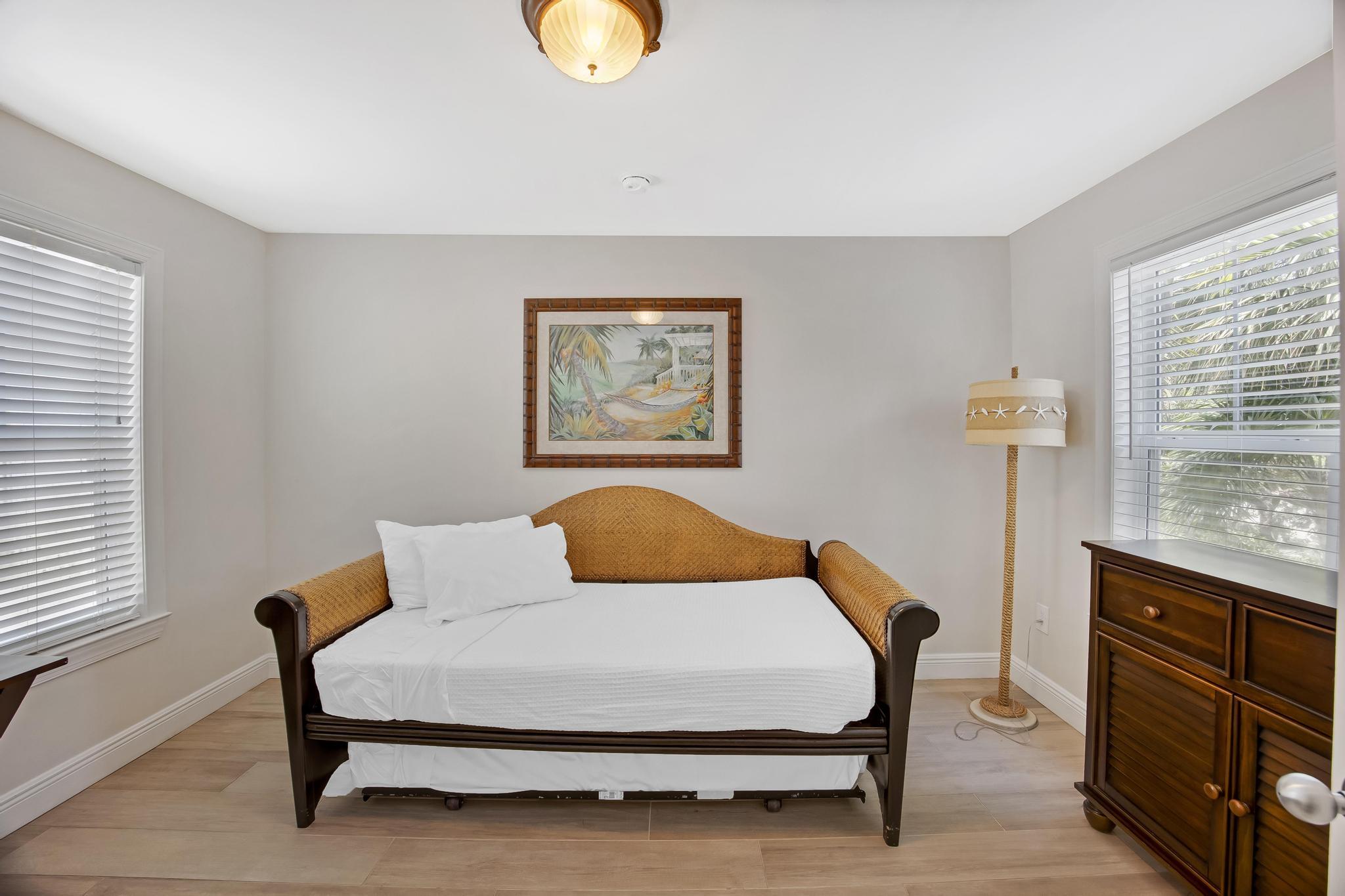 7204 Simran Lane Marathon, FL 33050 - Photo 23 of 47 a bedroom with a bed and cabinet