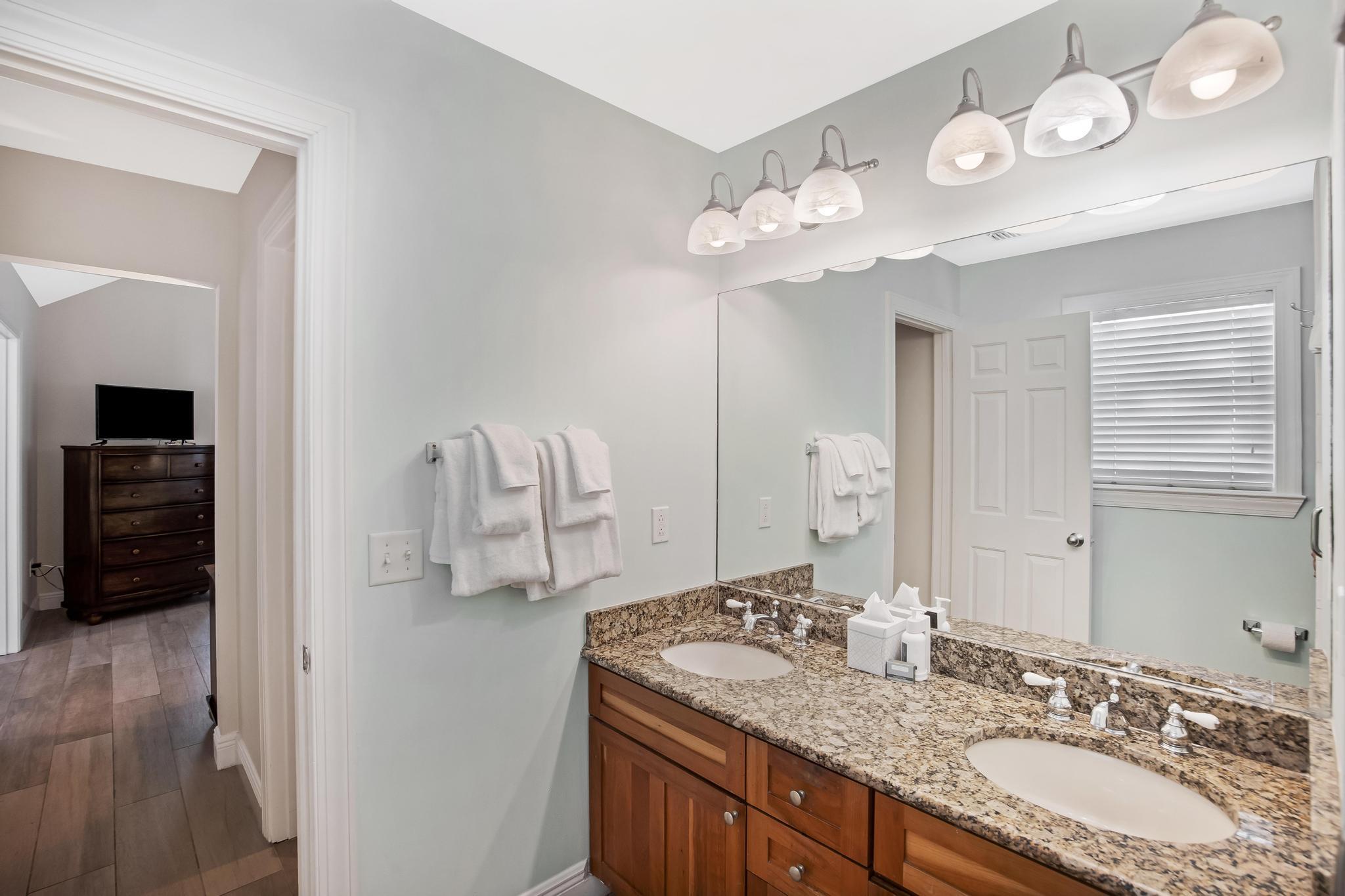7204 Simran Lane Marathon, FL 33050 - Photo 27 of 47 a bathroom with a granite countertop double vanity sink and a mirror