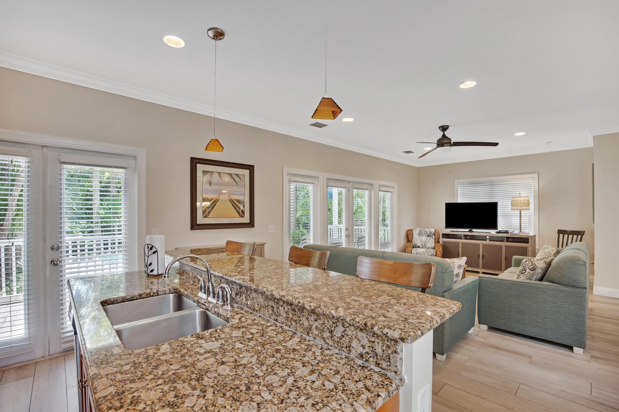 7204 Simran Lane Marathon, FL 33050 - Photo 3 of 47 a living room with furniture and a flat screen tv