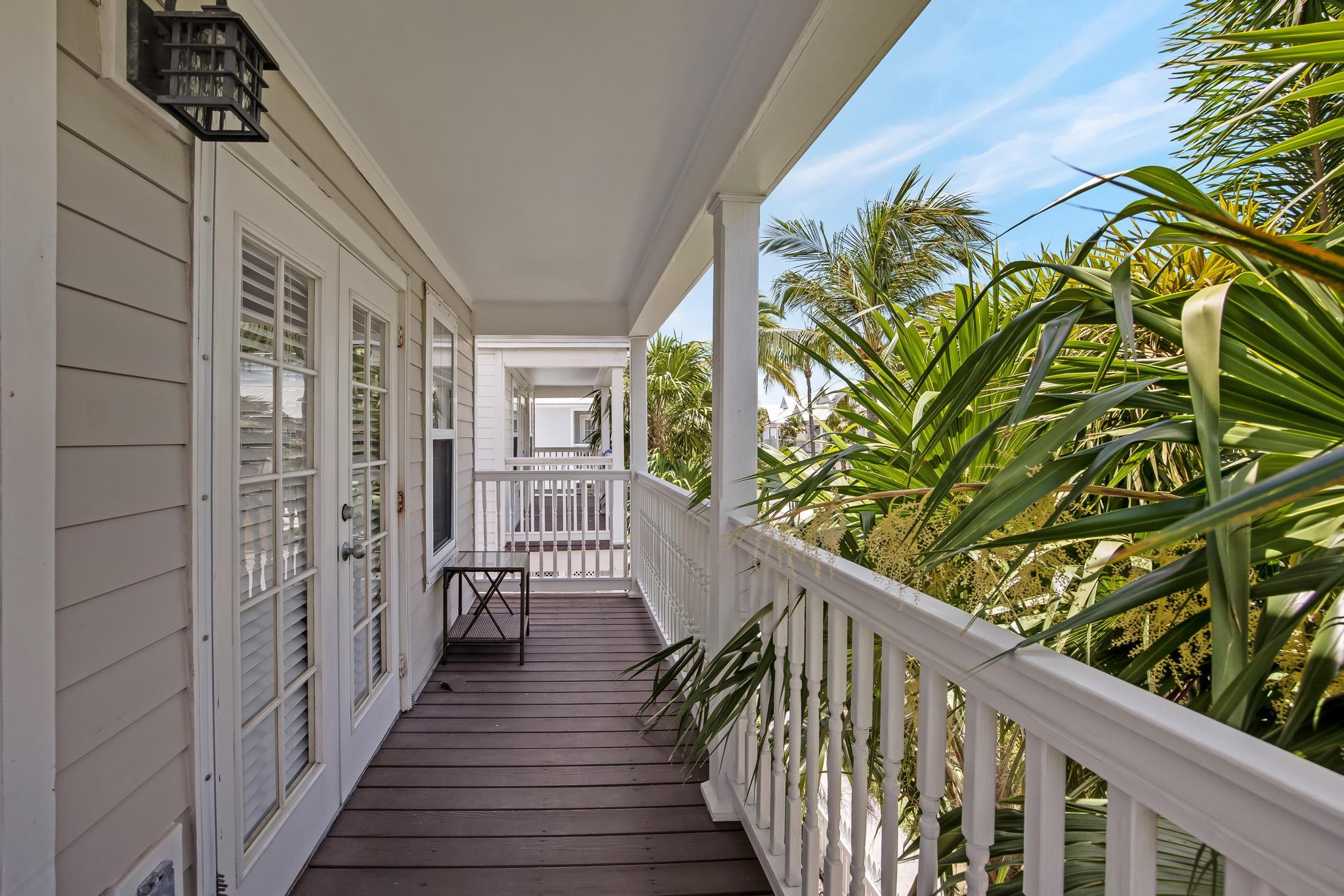 7204 Simran Lane Marathon, FL 33050 - Photo 38 of 47 a view of a balcony with wooden floor and fence