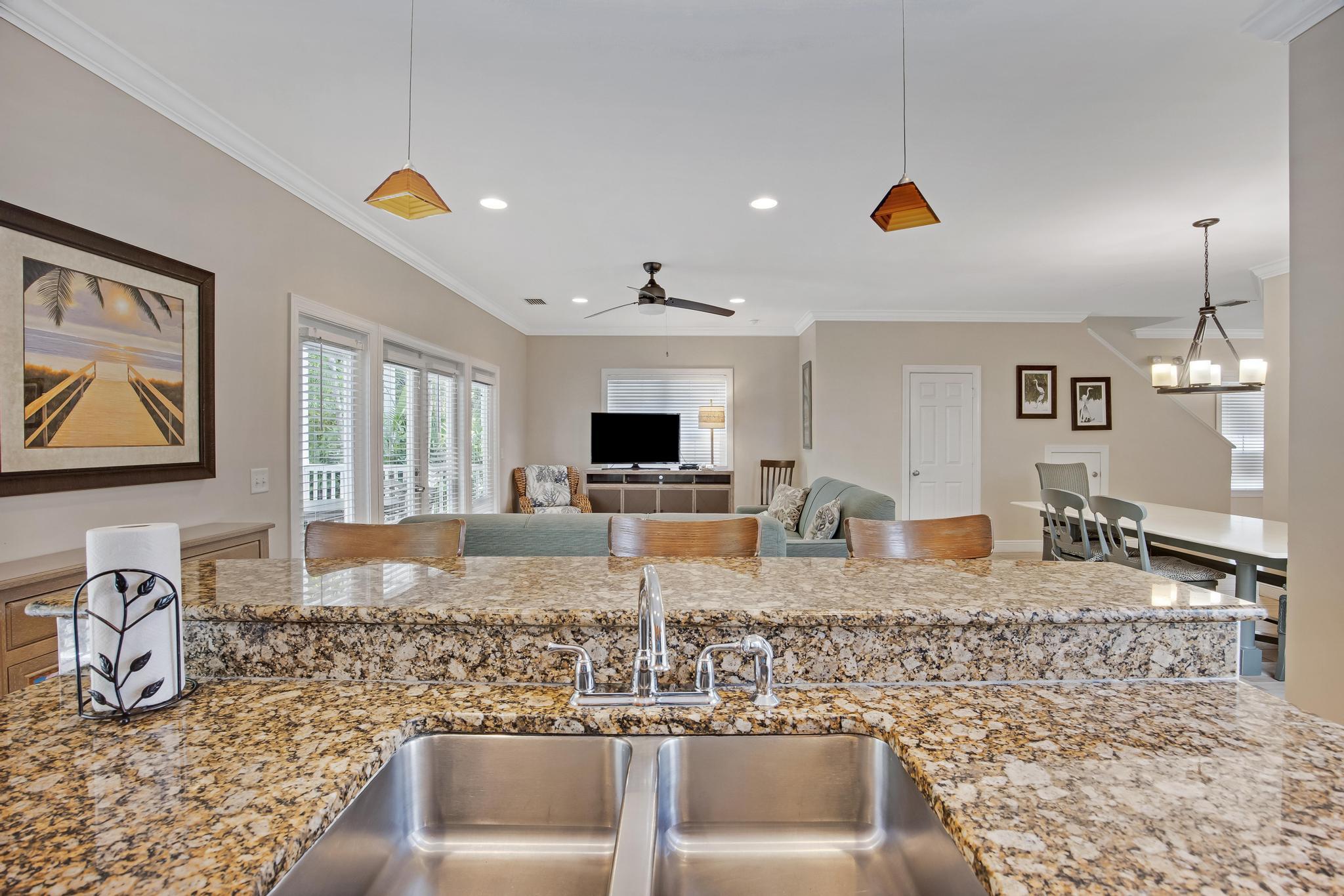 7204 Simran Lane Marathon, FL 33050 - Photo 6 of 47 a kitchen with granite countertop a sink and a stove top oven