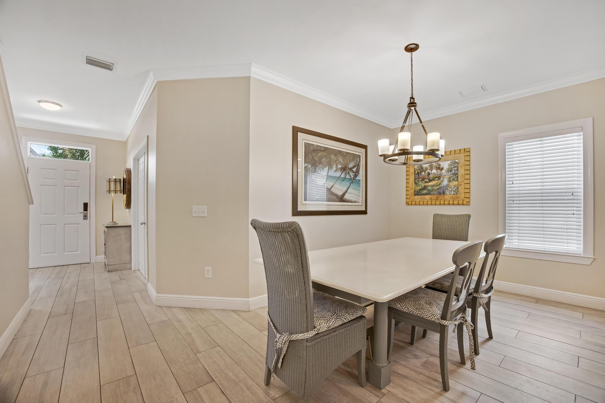 7204 Simran Lane Marathon, FL 33050 - Photo 8 of 47 a view of a dining room with furniture window and wooden floor