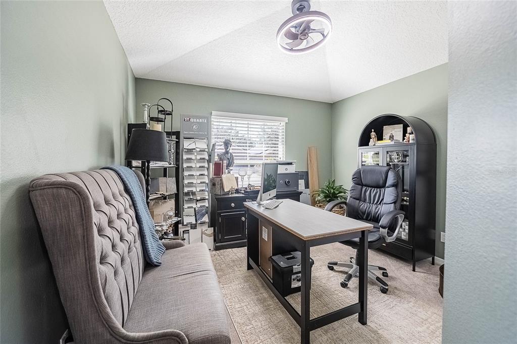 2524 Siena Way Valrico, FL 33596 - Photo 30 of 38 a view of a livingroom with furniture and a chandelier