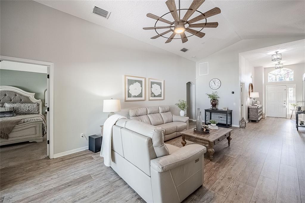 2524 Siena Way Valrico, FL 33596 - Photo 6 of 38 a living room with furniture and wooden floor