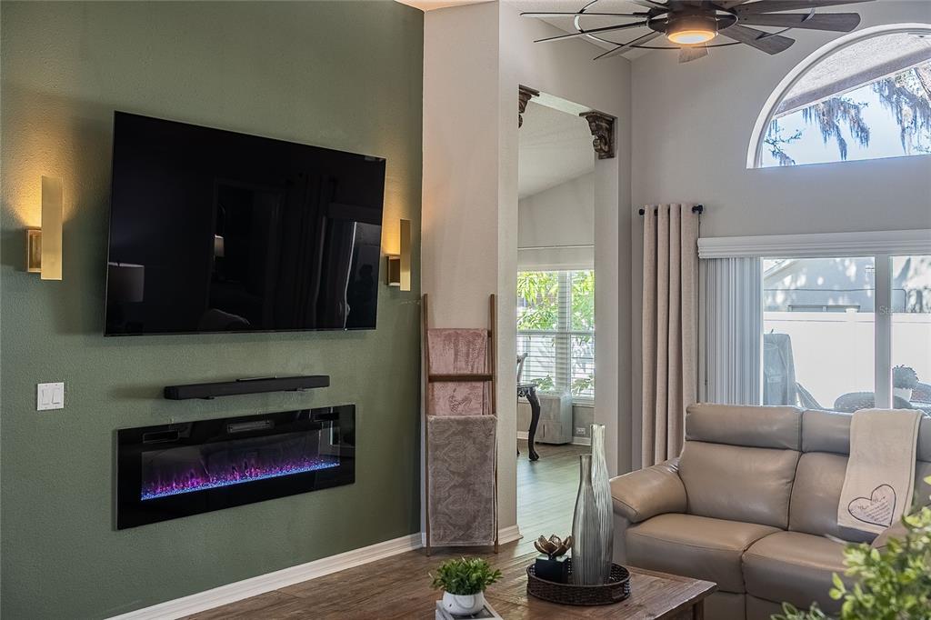 2524 Siena Way Valrico, FL 33596 - Photo 9 of 38 a living room with furniture and a fireplace