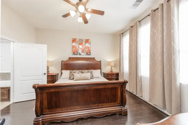 a room with a bed and a chandelier