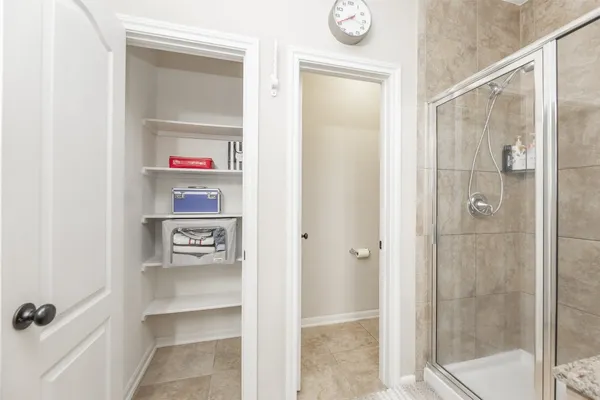 a bathroom with a shower and a sink