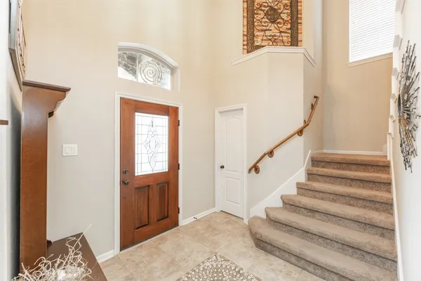 a view of entryway with wooden floor