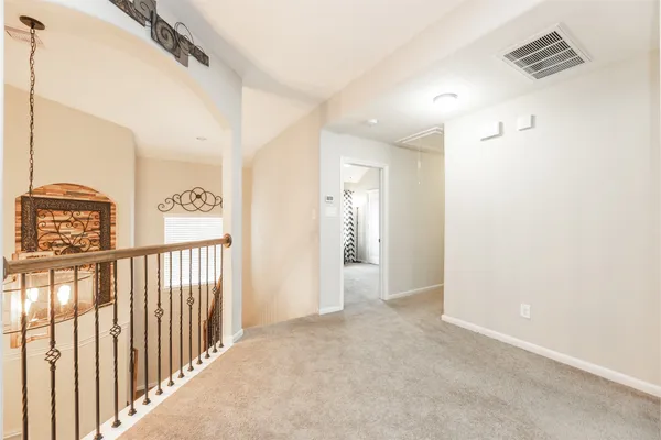 a living room with furniture a ceiling fan and a window