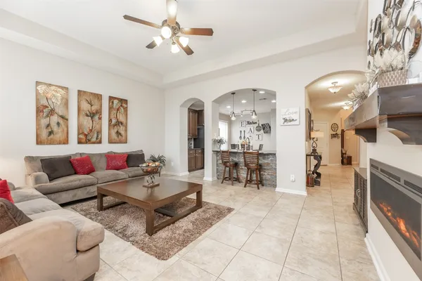 a living room with furniture and a fireplace