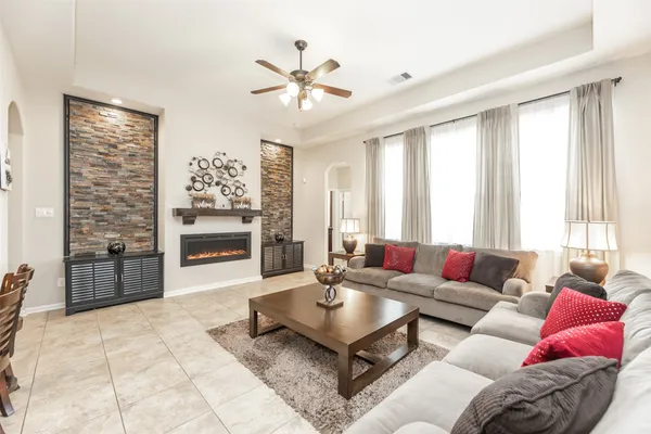 a living room with furniture and a large window