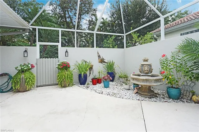 a view of a patio with couches and potted plants
