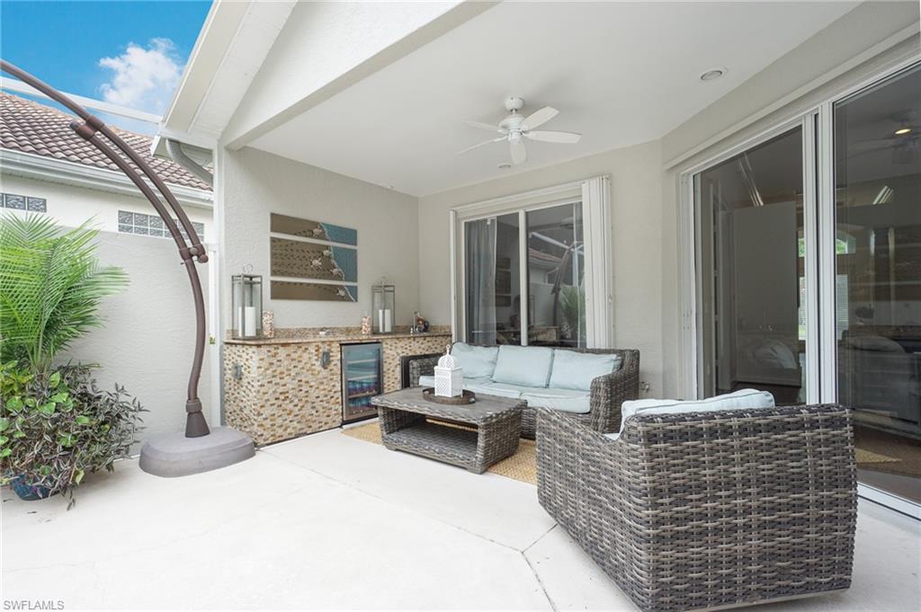 3188 Sundance Circle Naples, FL 34109 - Photo 13 of 39 a living room with furniture