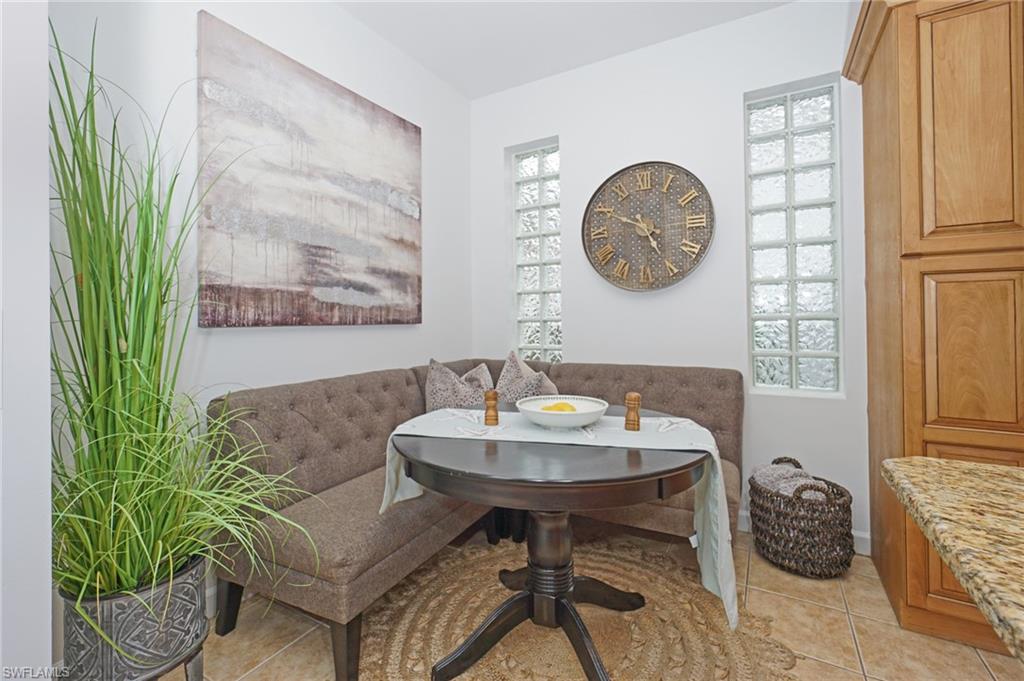 3188 Sundance Circle Naples, FL 34109 - Photo 20 of 39 a view of a dining room with furniture and a table